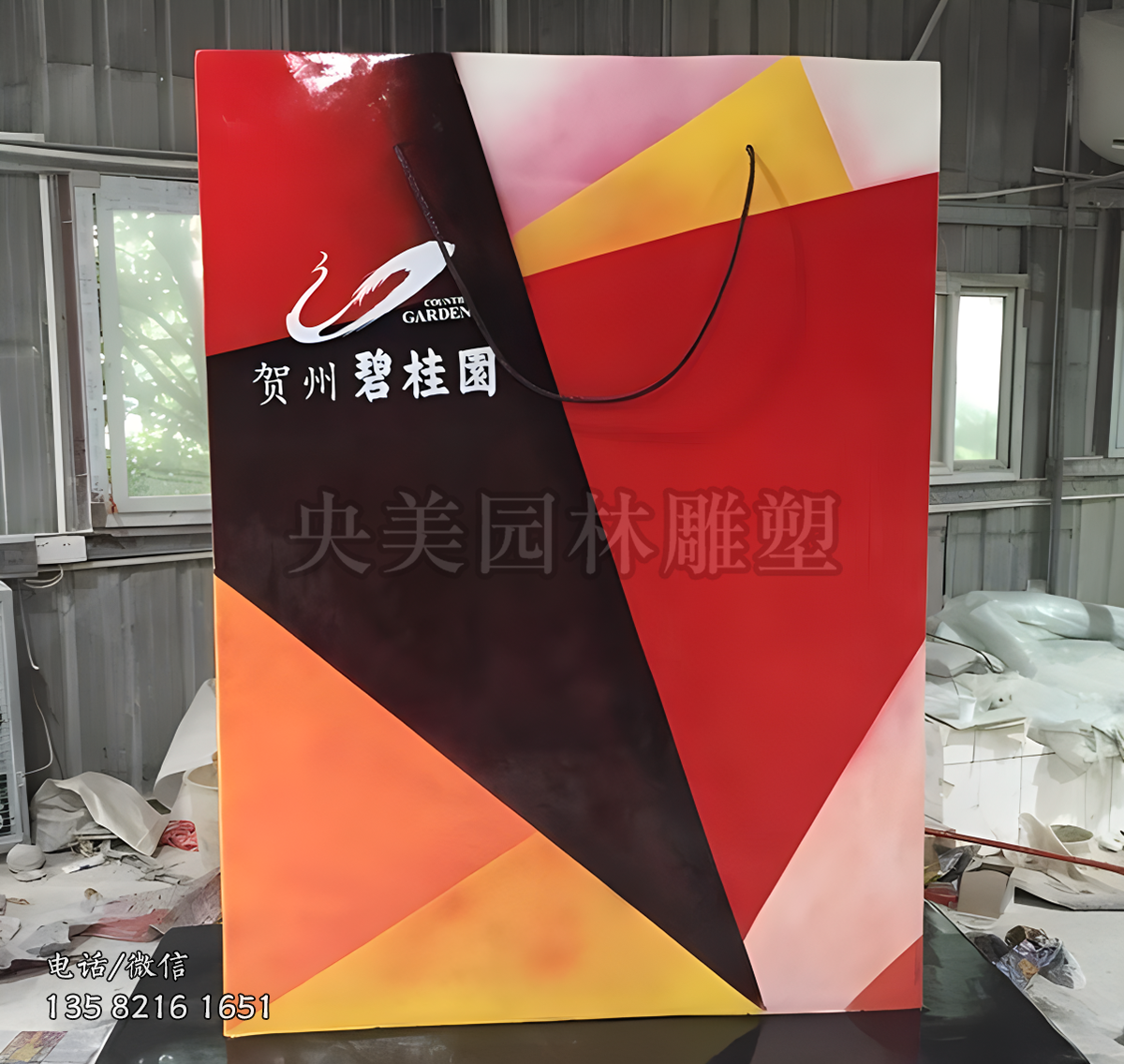 不銹鋼彩繪購(gòu)物袋雕塑